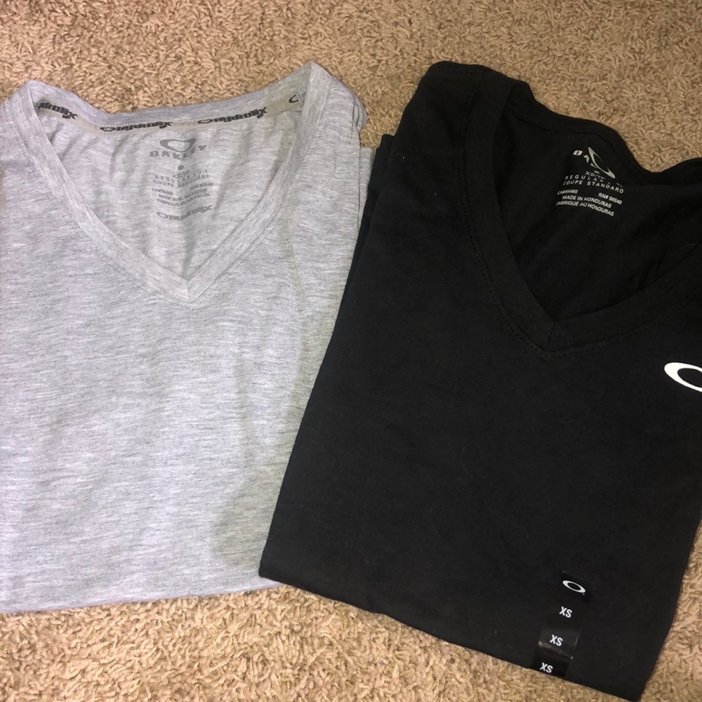 two oakley short sleeve vnecks